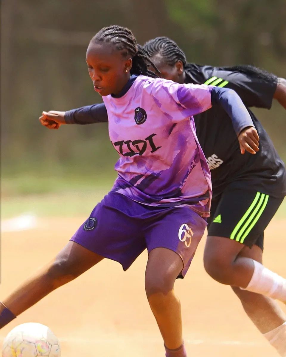 A player striking the ball on the turn in a cloud of dust