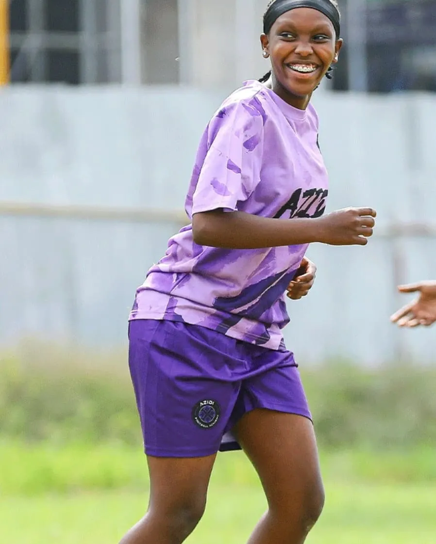 A player running with the ball during a training session